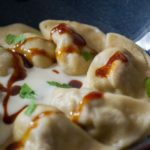 Raviole de paleron de bœuf confit, crème de parmesan et jus de volaille